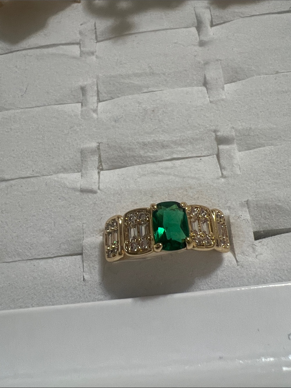 Gold Ring with Green Emerald-Cut Center and Sparkling Side Stones